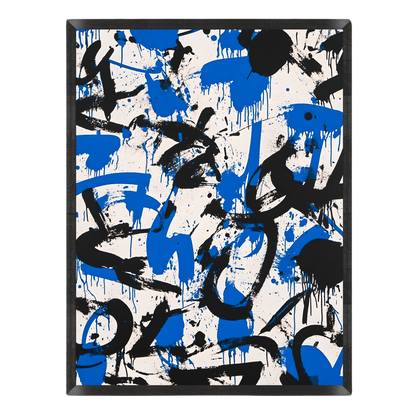 Abstract wall art featuring bold black and royal blue paint splatters and drips on a white background, enclosed in a thin black frame.