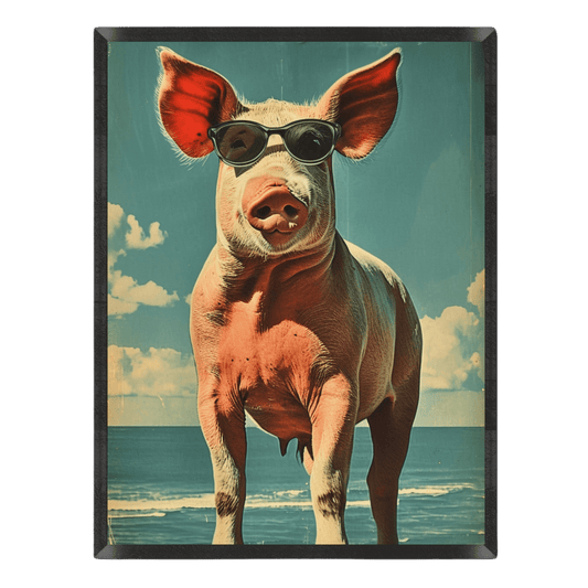 Funny retro beach poster featuring a pink pig wearing black sunglasses standing on a tropical ocean beach under a blue sky, styled with a vintage postcard aesthetic inside a thin black frame.