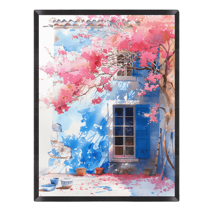 Watercolor landscape art print featuring a rustic blue house with bright blue shutters, framed by vibrant pink bougainvillea cherry blossoms and fallen petals on the ground, enclosed in a thin black frame.